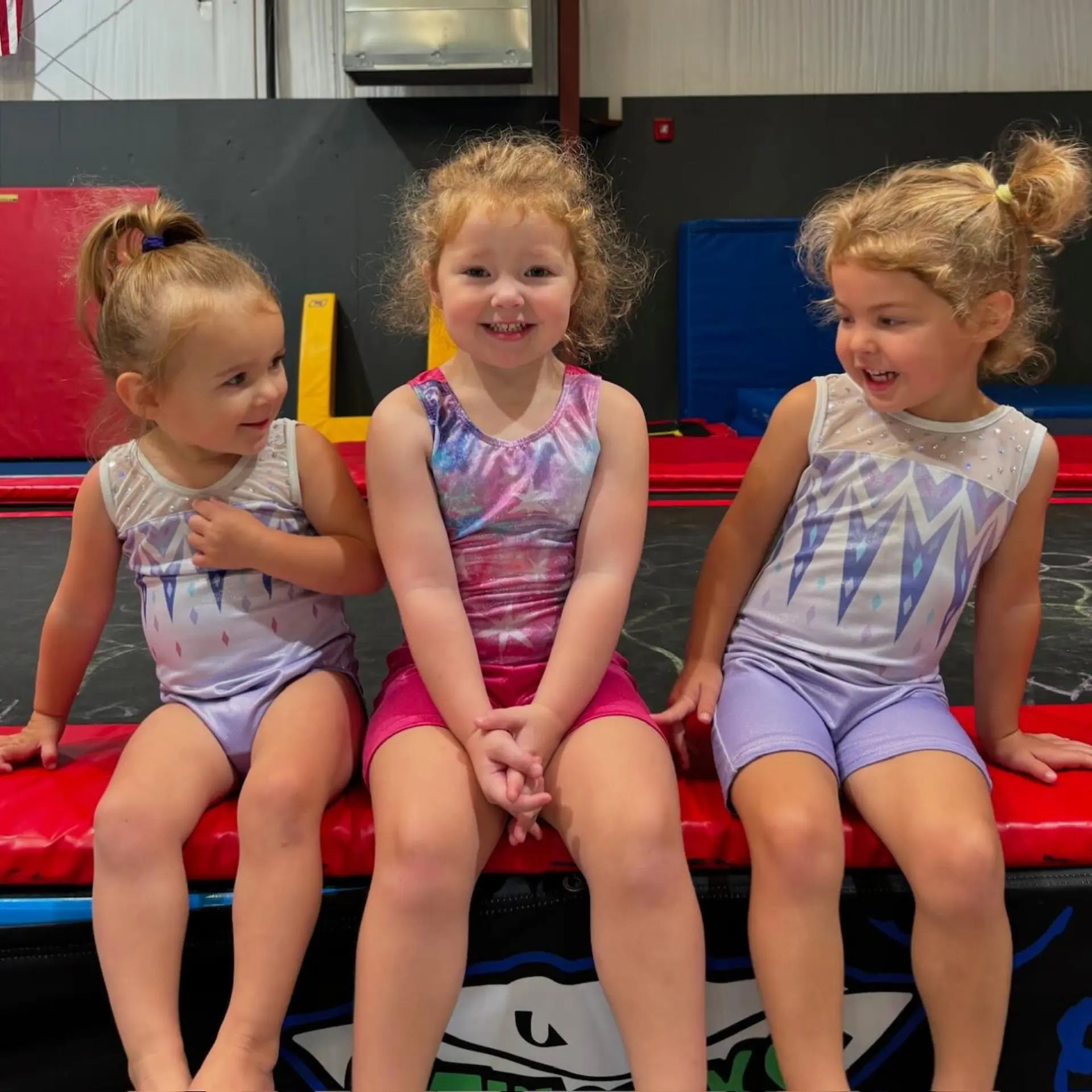 Three young, smiling children.